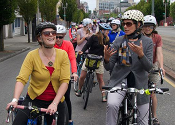 A group of people on bikes facing the camera.